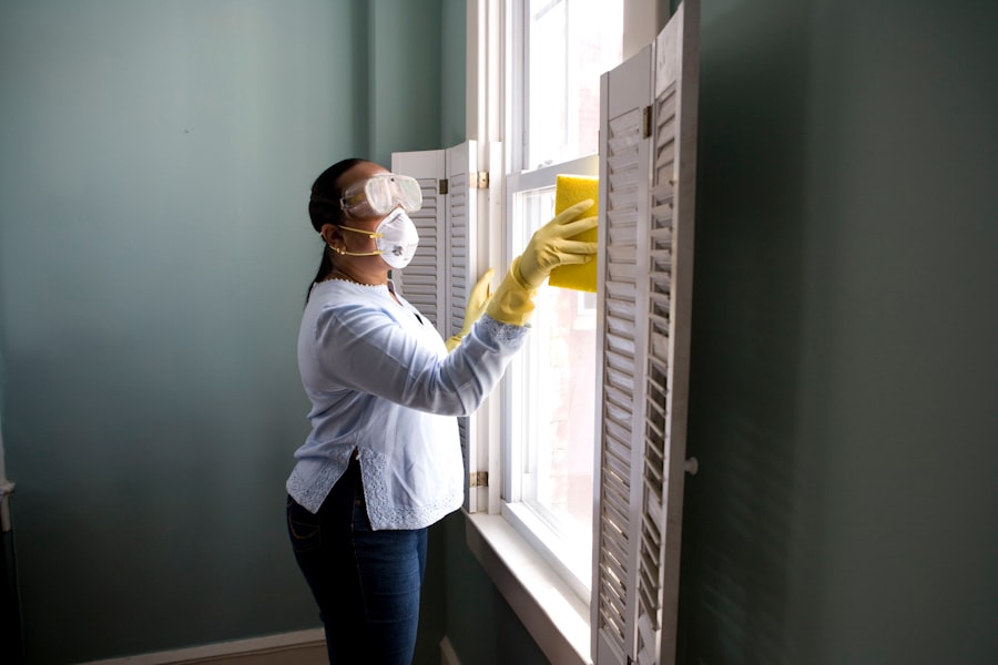 Professional cleaner wiping a bright modern kitchen surface